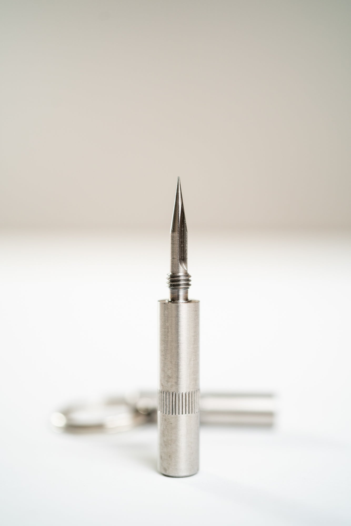 "Trilogy" Cigar Punch . Silver tool with pointed triangle top for premium cigars