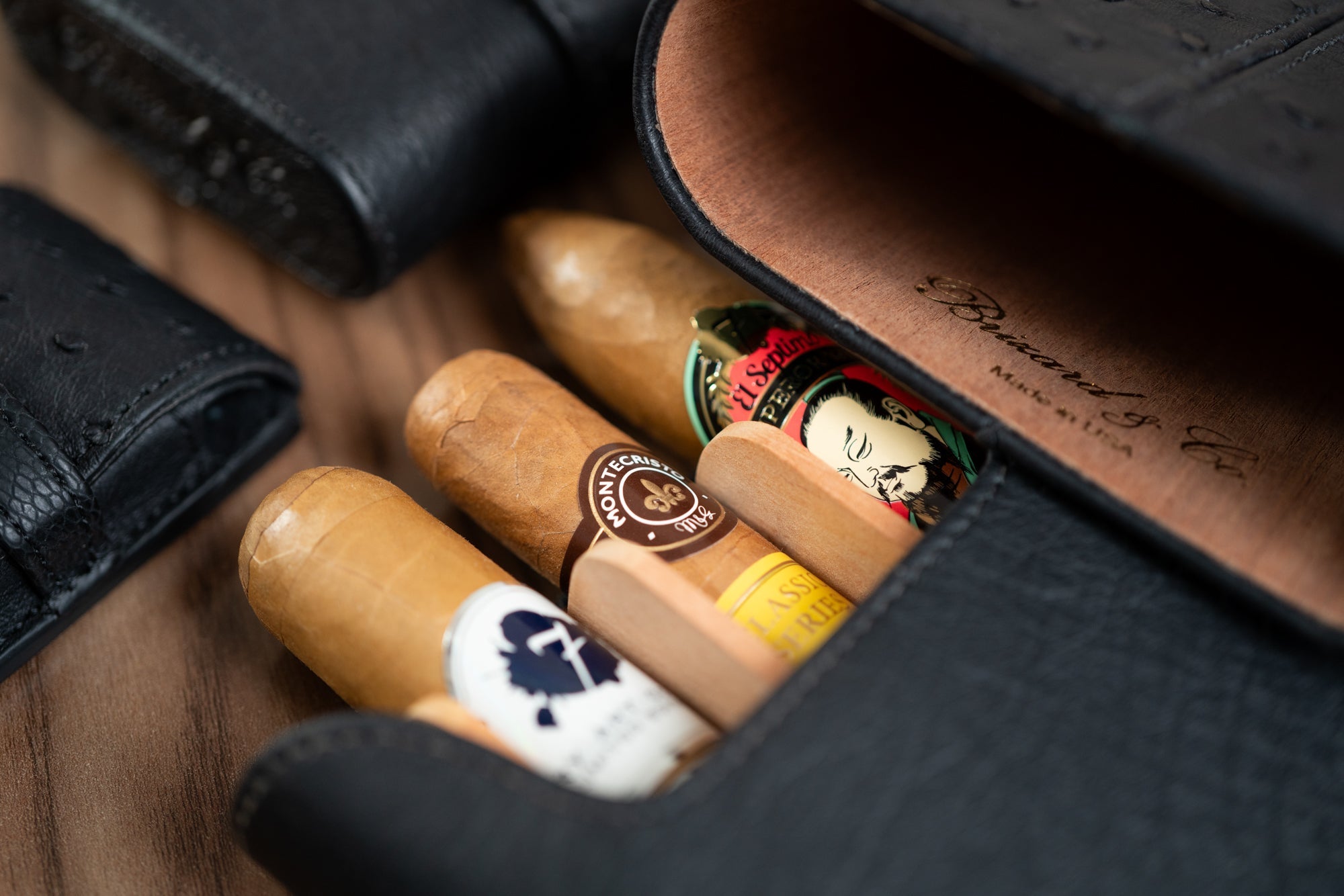 3 premium cigars in black leather Brizard and Co show band case.