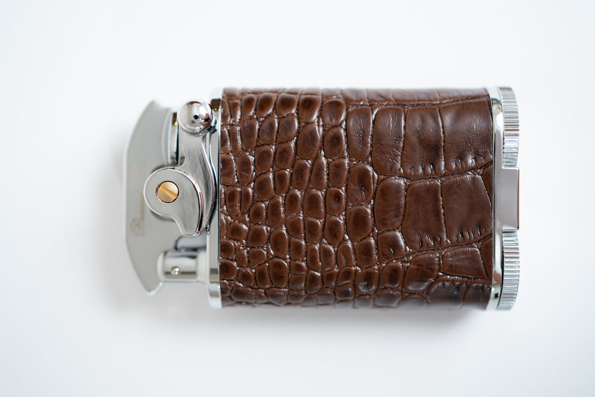 side view of the brown Gatsby Table Lighter, showing off the refined crocodile pattern.