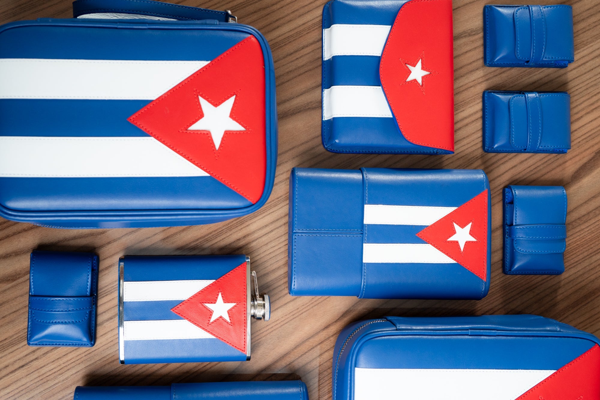 The Havana Traveler is the ultimate companion for the discerning cigar lover. The set features the Cubanl flag that has been meticulously handcrafted from the finest top grain leather and lined with rich suede, this luxury accessory is designed to protect, organize, and elevate your cigar experience wherever you go.