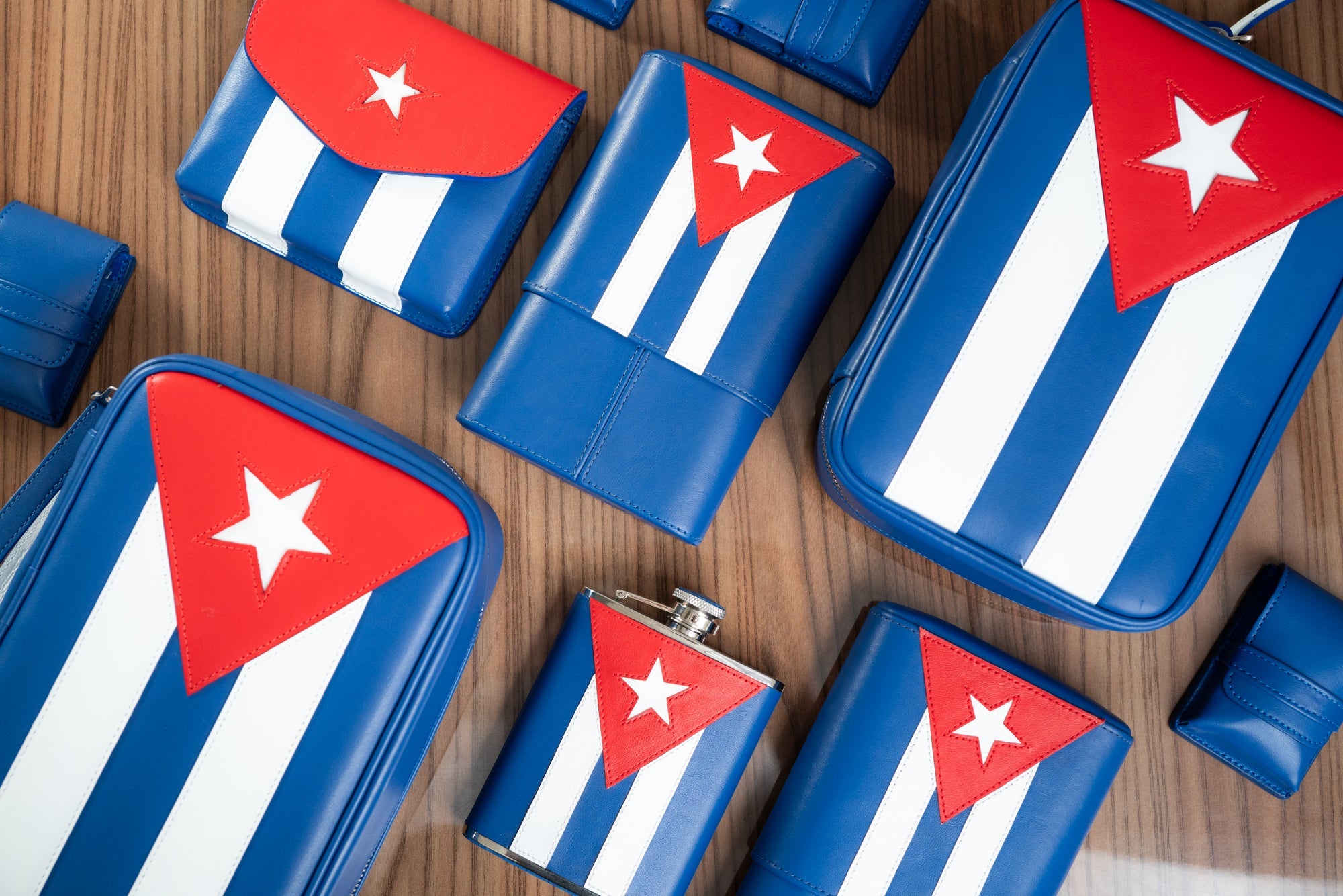 Cuban flag traveling set featuring a 6oz flask, cigar case, lighter holder and more.