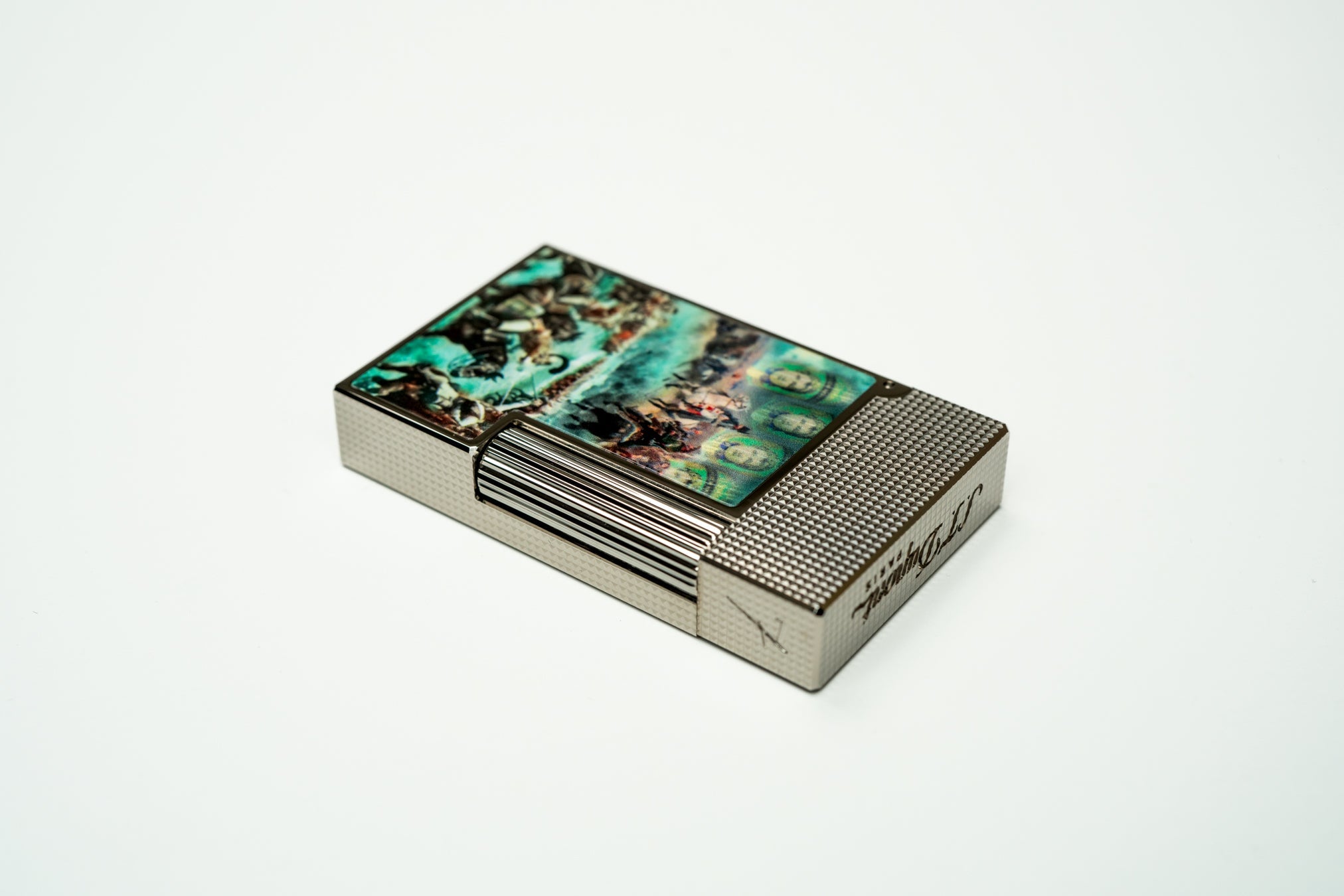 ST Dupont X El Septimo luxury cigar lighter with palladium and diamond head guilloche pattern.