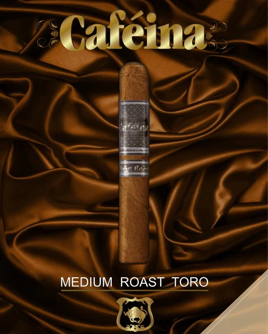 A single cigar resting on a brown, velvet-like surface with the brand name 'CAFEINA' displayed above in a decorative font, and the text 'MEDIUM ROAST TORO' below the cigar. The background is dark and smooth, giving a luxurious feel to the product.