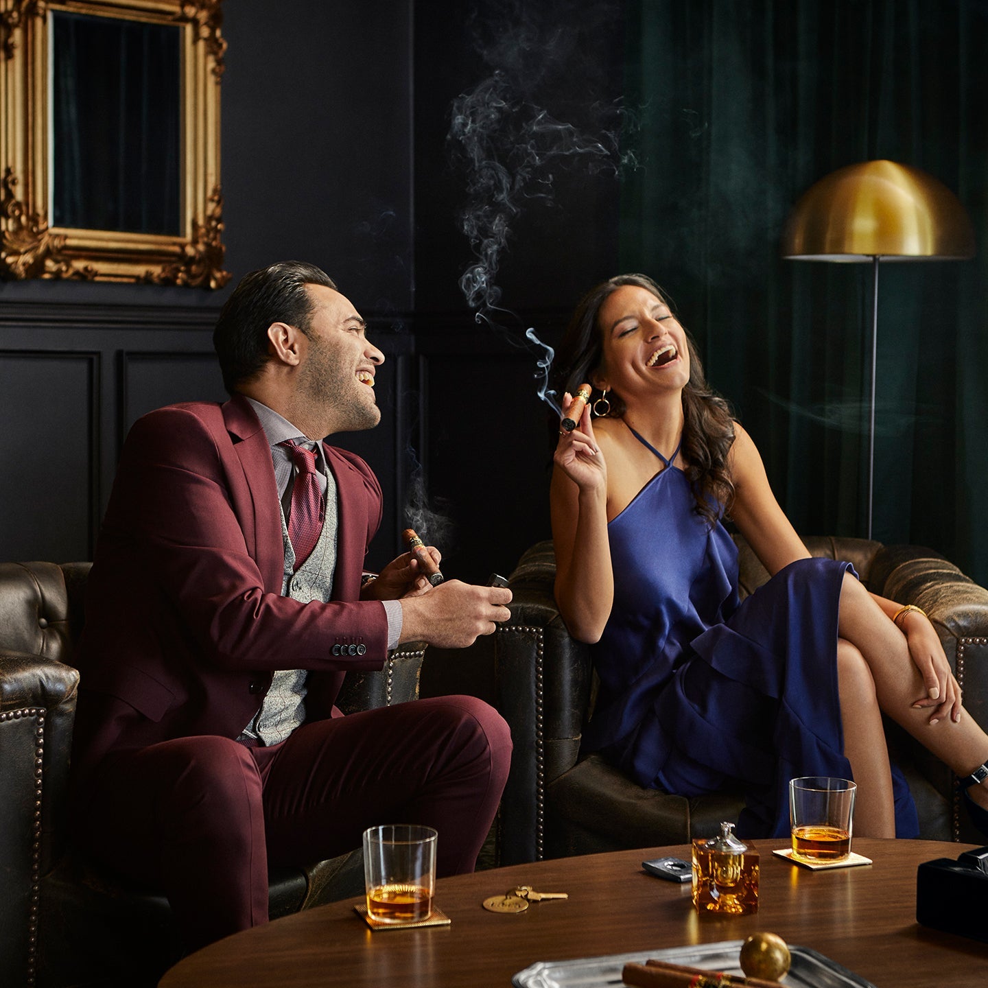 couple enjoying a La Aurora 115th Anniversary Limited Edition cigar at Los Angeles cigar shop